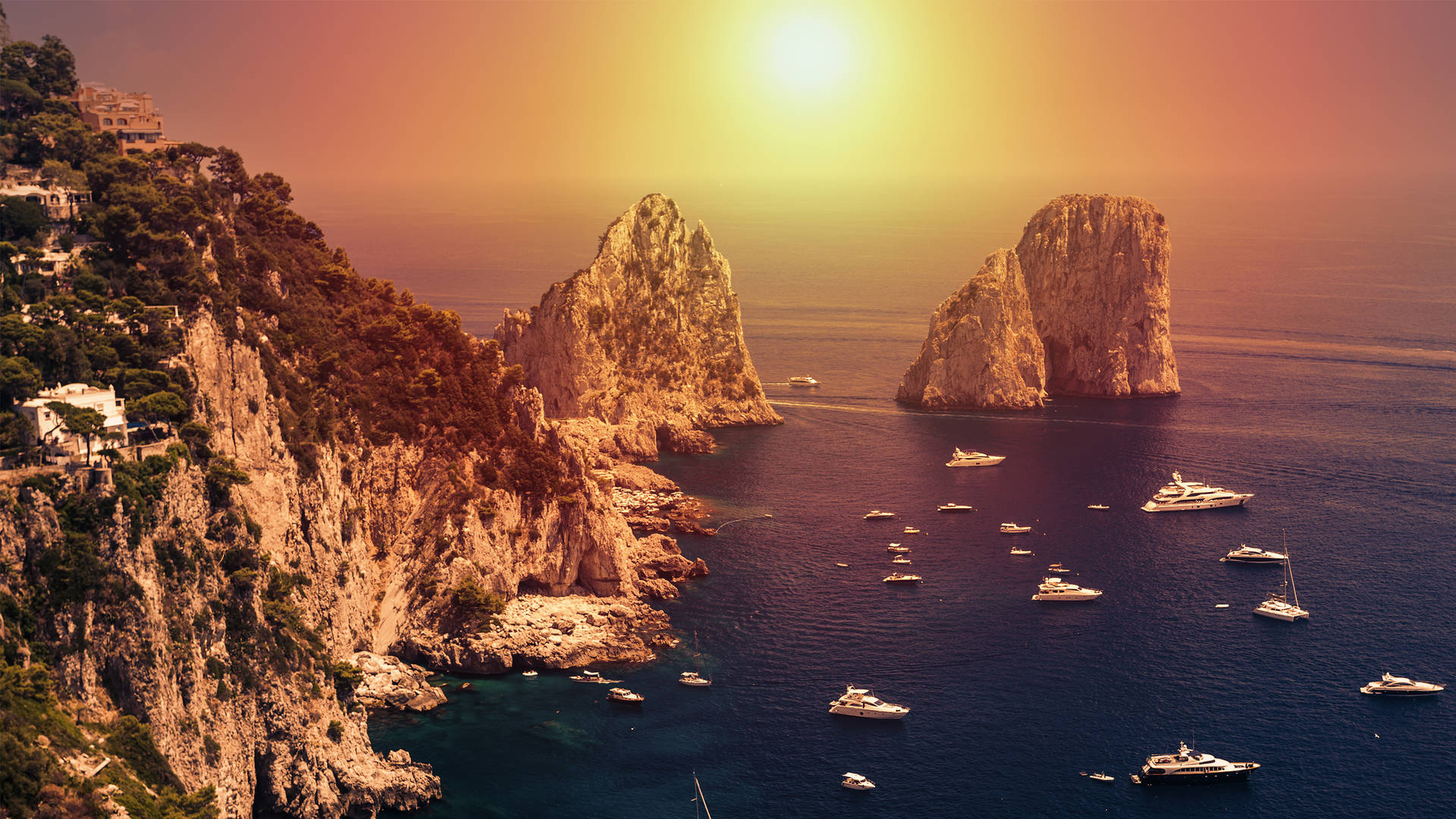 Sunrise over Faraglioni rocks in Capri